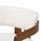 Close-up of cream boucle upholstery on chair arm