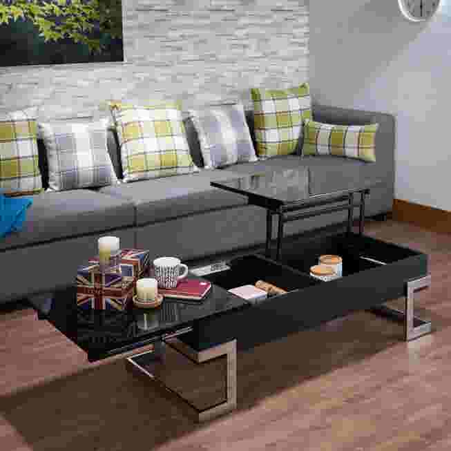 Black coffee table with lift top raised, showing storage space