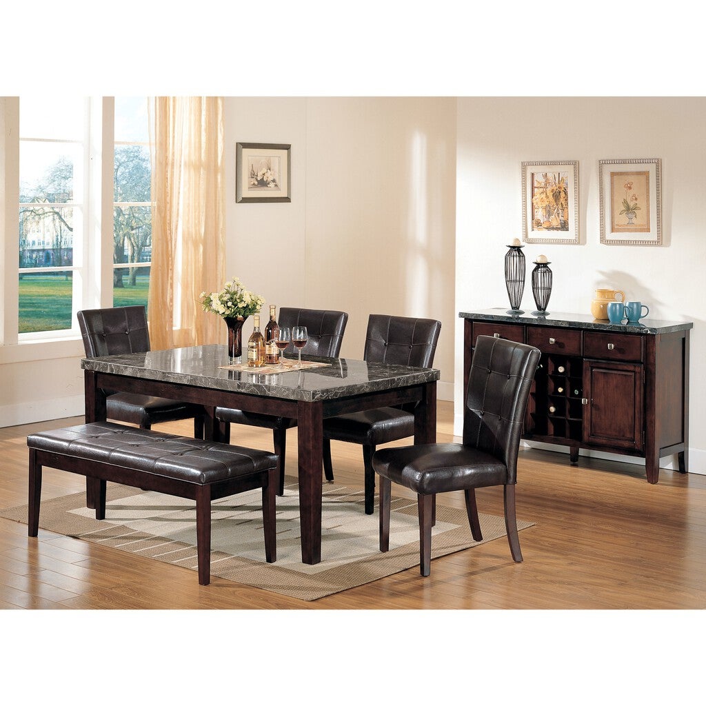 Dining room with a rectangular dark wood table and six black leather chairs around it