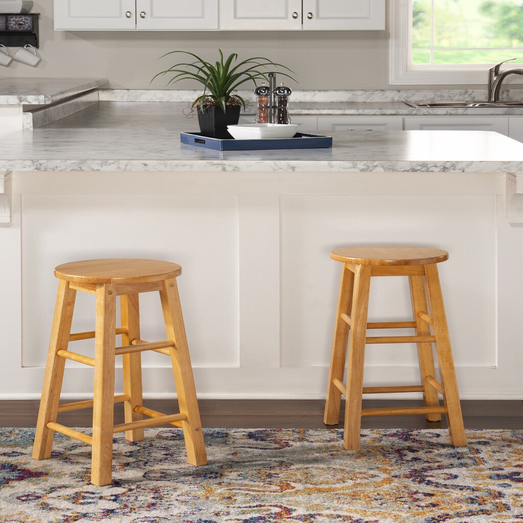 Wooden stool with round seat, partial background