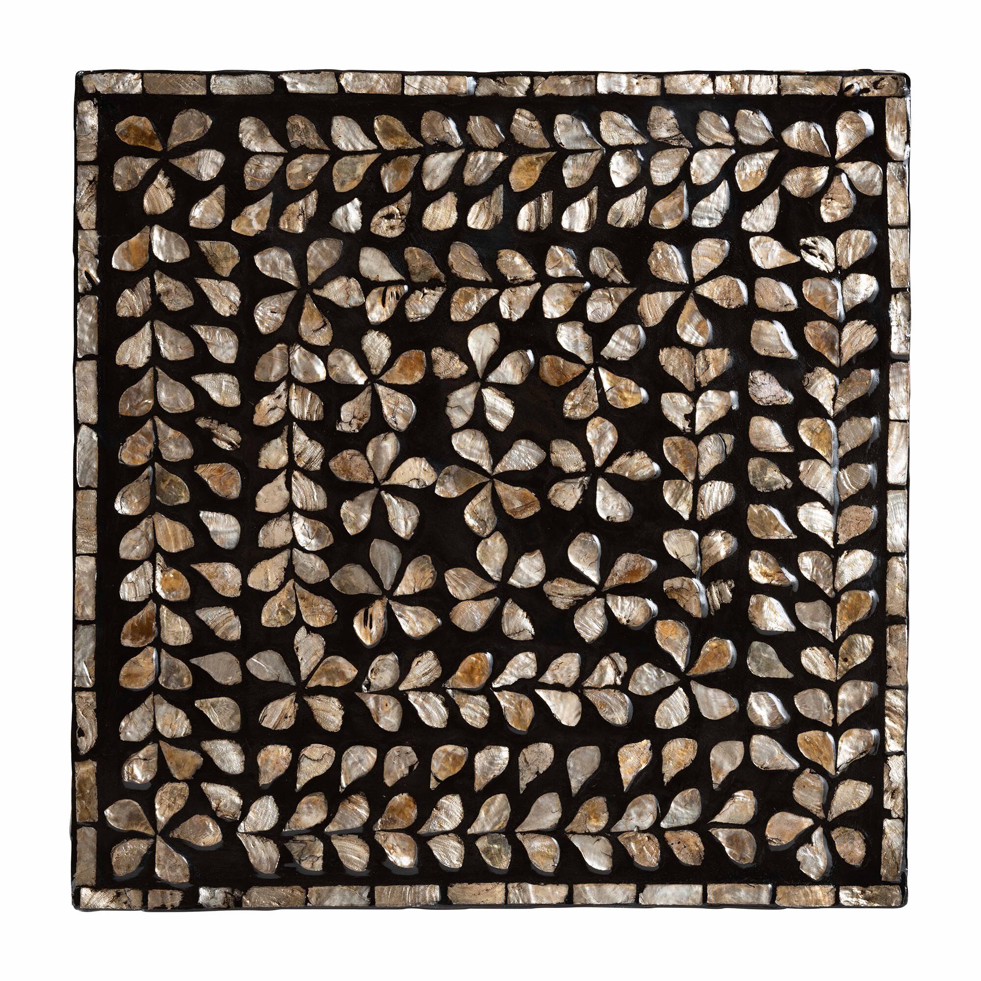 Top-down view of the mother of pearl inlay pattern on the end table.