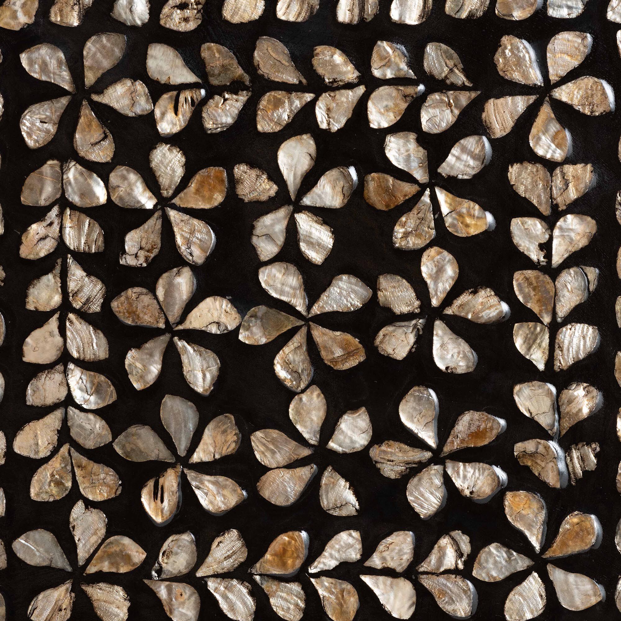 Close-up of the floral mother of pearl inlay pattern on the end table.