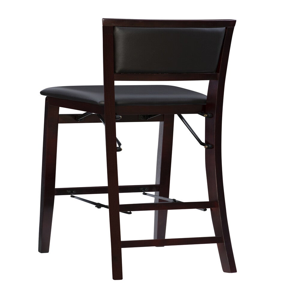 Side view of a dark wood bar stool with black cushioned seat, slightly curved legs, and metal support bars.