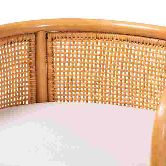 Close-up of the backrest of a natural rattan counter stool
