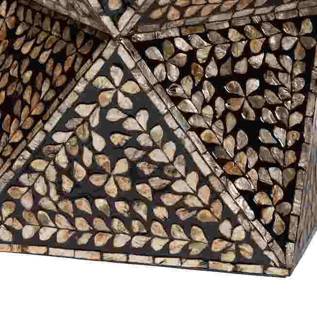 Close-up of the intricate mother of pearl inlay pattern on the end table.