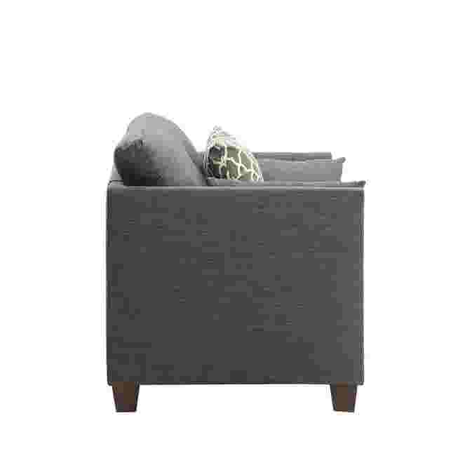 Side view of a dark gray armchair with studded details