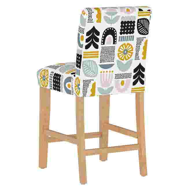 Rear view of the Helsinki Block Counter Stool with a patterned fabric cover featuring geometric and floral designs.