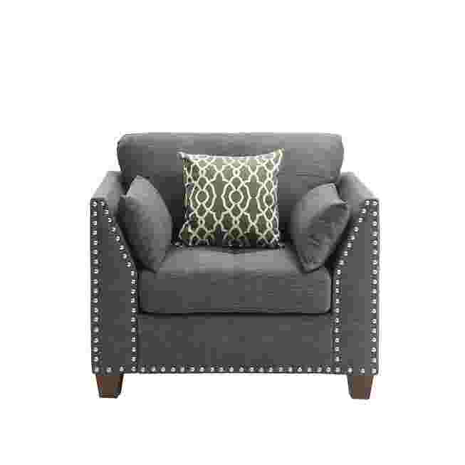 Dark gray armchair with studded details and a patterned pillow