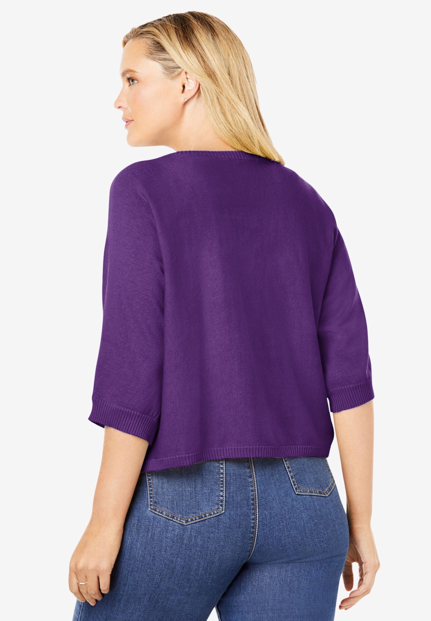 Woman within outlet shrugs