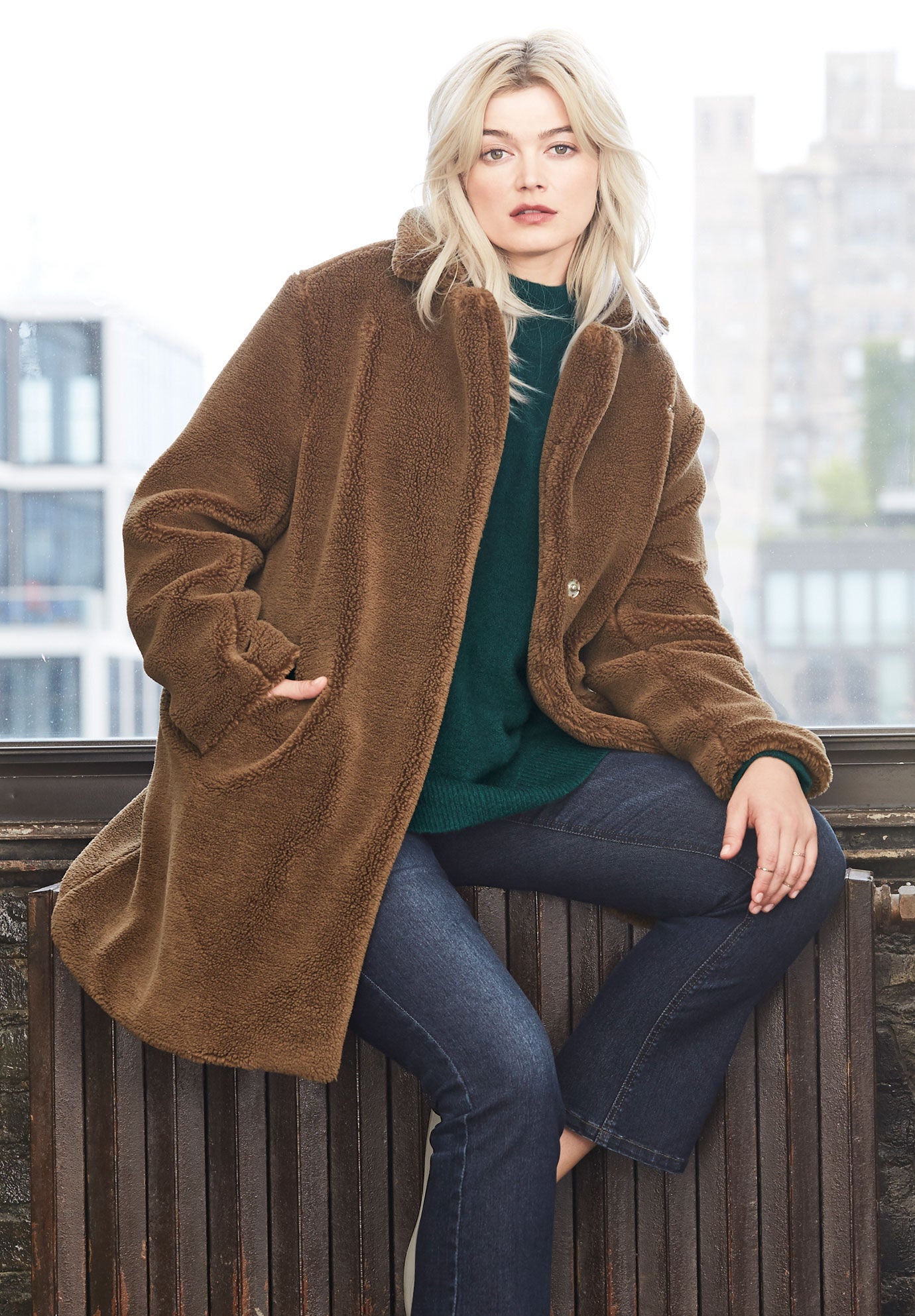 Woman within top faux fur coat