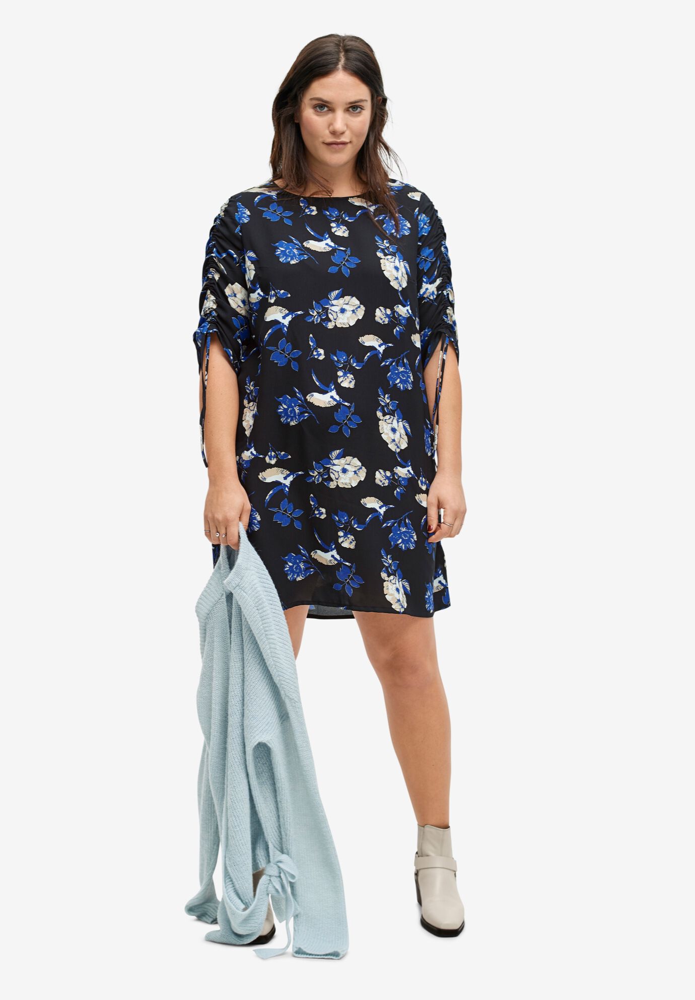 woman within denim dress