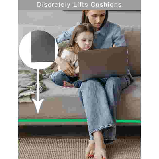 A woman and child sitting on a sofa with a laptop, using the cushion support.